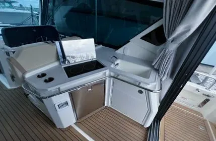  Yacht Photos Pics 2023 Aquila 36 Sport yacht interior with modern kitchenette and sleek design.