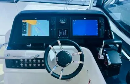  Yacht Photos Pics Helm of 2023 Aquila 36 Sport with modern navigation displays and controls.