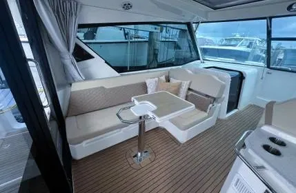  Yacht Photos Pics 2023 Aquila 36 Sport yacht interior with elegant seating and table.