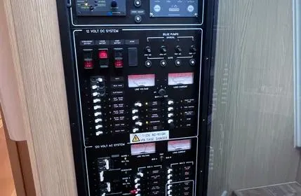  Yacht Photos Pics Electrical control panel on 2023 Aquila 36 Sport boat, featuring various switches and indicators.