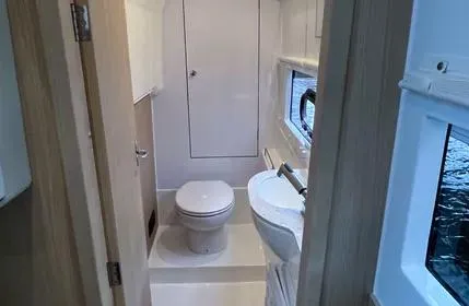  Yacht Photos Pics 2023 Aquila 36 Sport yacht bathroom with modern fixtures and ocean view.
