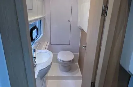  Yacht Photos Pics 2023 Aquila 36 Sport yacht bathroom with modern fixtures and compact design.