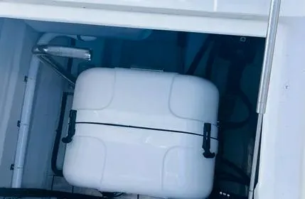  Yacht Photos Pics 2023 Aquila 36 Sport storage compartment with white equipment box.