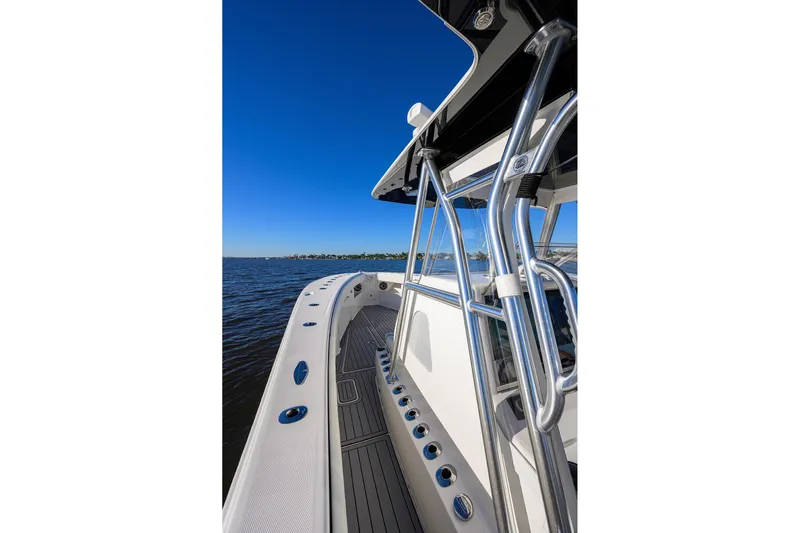 Barefoot In Public Yacht Photos Pics 2023 SeaVee 370Z boat on water, showcasing sleek design and stainless steel features.