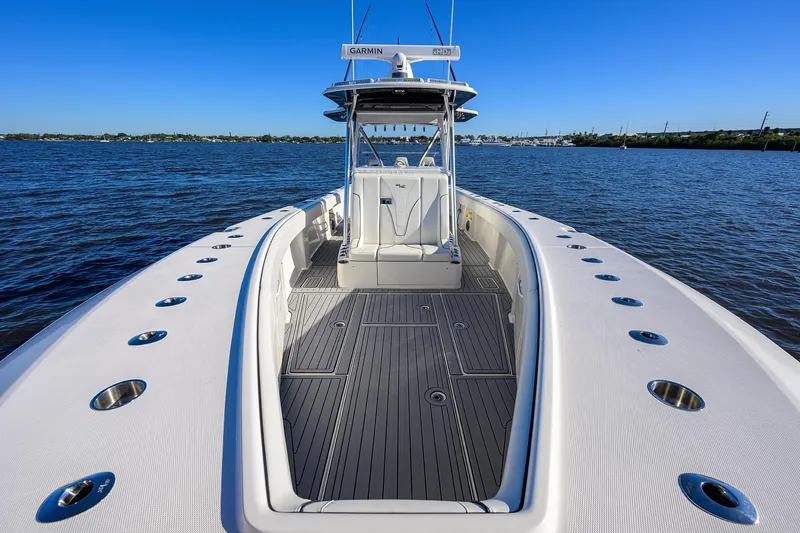 Barefoot In Public Yacht Photos Pics 2023 SeaVee 370Z boat on water, showcasing spacious deck and sleek design.