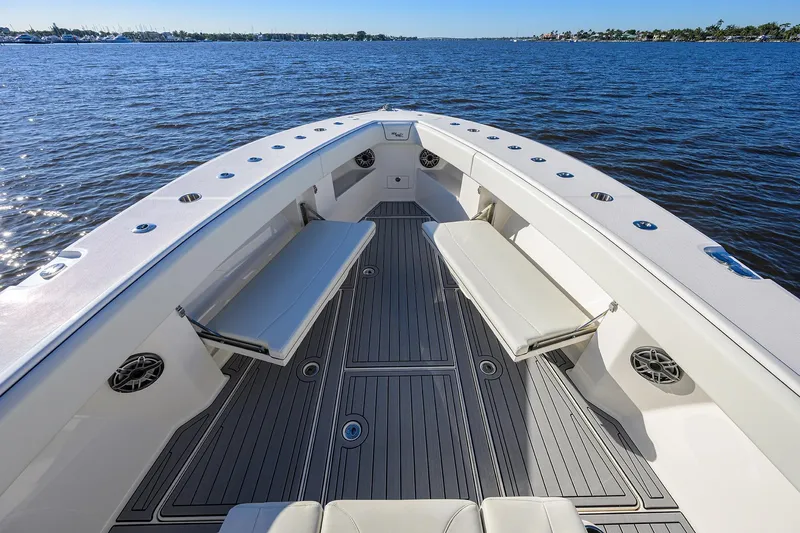 Barefoot In Public Yacht Photos Pics 2023 SeaVee 370Z boat interior with seating, on calm water.