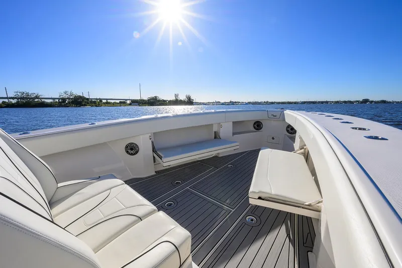 Barefoot In Public Yacht Photos Pics 2023 SeaVee 370Z boat interior with sunlit seating and ocean view.