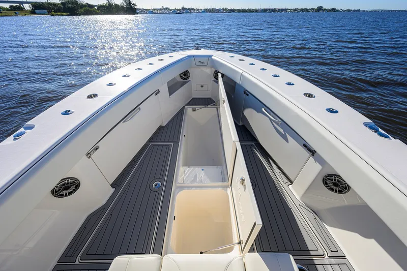 Barefoot In Public Yacht Photos Pics 2023 SeaVee 370Z boat interior with open storage, sleek design, and ocean view.