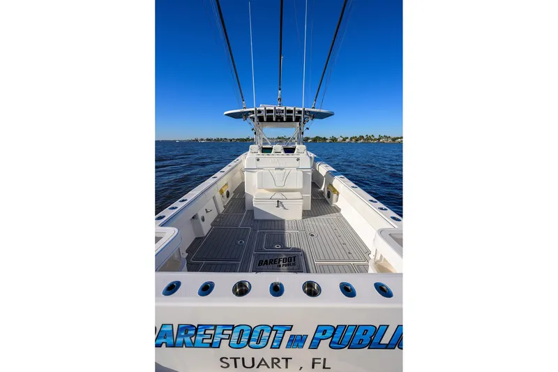 Barefoot In Public Yacht Photos Pics 2023 SeaVee 370Z boat on water, clear sky, Stuart, FL.