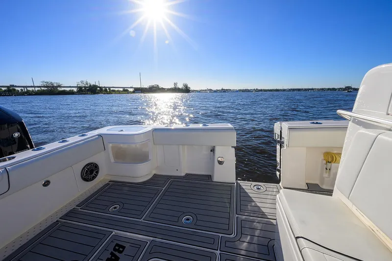 Barefoot In Public Yacht Photos Pics 2023 SeaVee 370Z boat deck with sunlit water view.