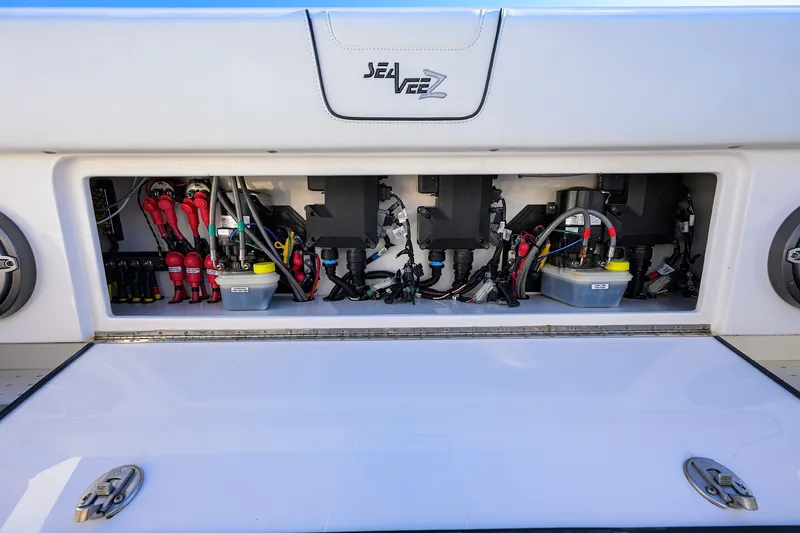 Barefoot In Public Yacht Photos Pics 2023 SeaVee 370Z boat electrical compartment with wiring and components visible.