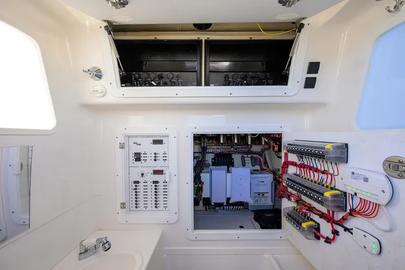 Barefoot In Public Yacht Photos Pics 2023 SeaVee 370Z electrical panel with advanced wiring and control systems.
