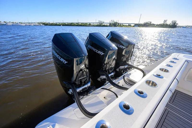 Barefoot In Public Yacht Photos Pics 2023 SeaVee 370Z boat with triple Mercury outboard engines on a sunny day.