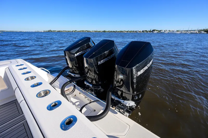 Barefoot In Public Yacht Photos Pics 2023 SeaVee 370Z boat with triple Mercury outboard engines on open water.