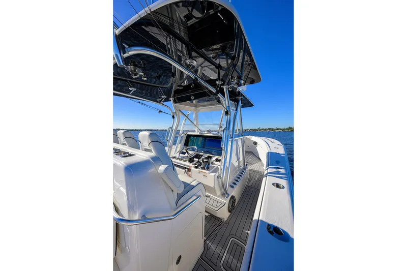 Barefoot In Public Yacht Photos Pics 2023 SeaVee 370Z boat interior with helm, seats, and ocean view.
