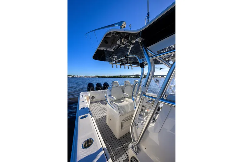 Barefoot In Public Yacht Photos Pics 2023 SeaVee 370Z boat interior with sleek seating and modern design on open water.