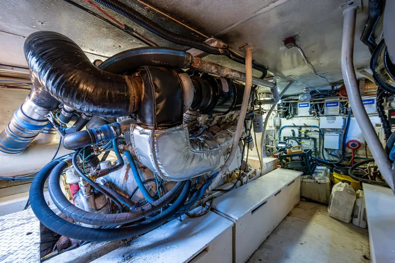 Able Hand Yacht Photos Pics Engine room of a 1978 Graves 51 boat, featuring complex machinery and piping.