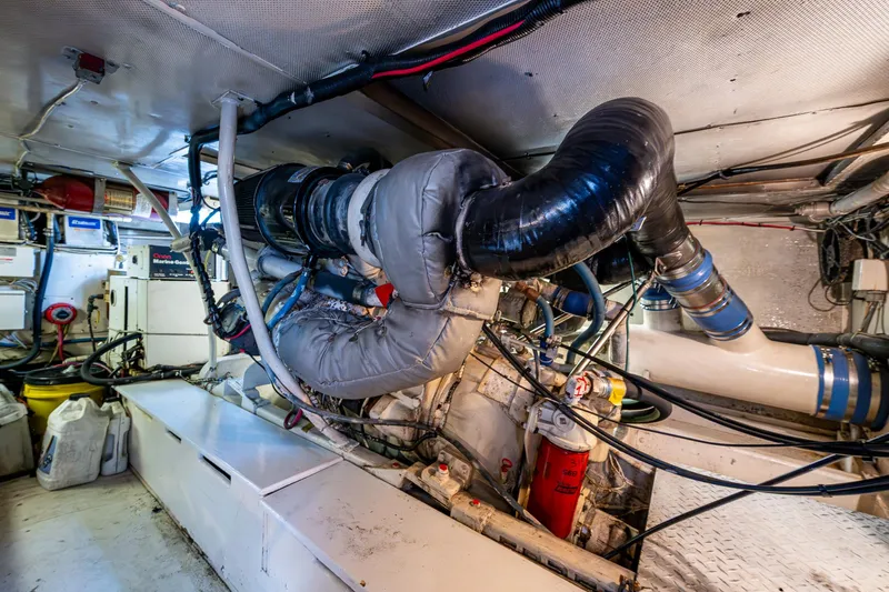 Able Hand Yacht Photos Pics Engine room of a 1978 Graves 51 boat, featuring complex machinery and piping.