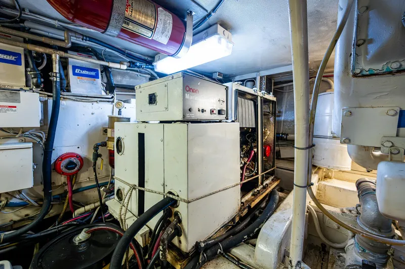 Able Hand Yacht Photos Pics Engine room of a 1978 Graves 51 boat with Onan generator and equipment.