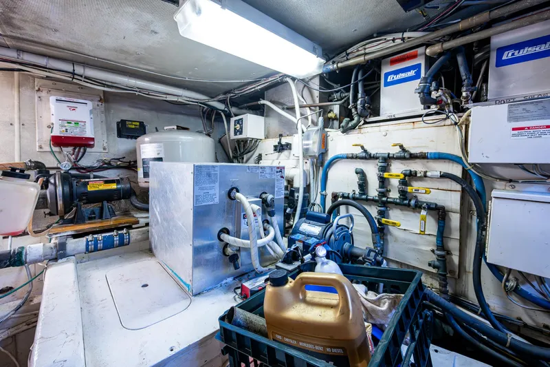 Able Hand Yacht Photos Pics Engine room of a 1978 Graves 51 boat with various equipment and piping.