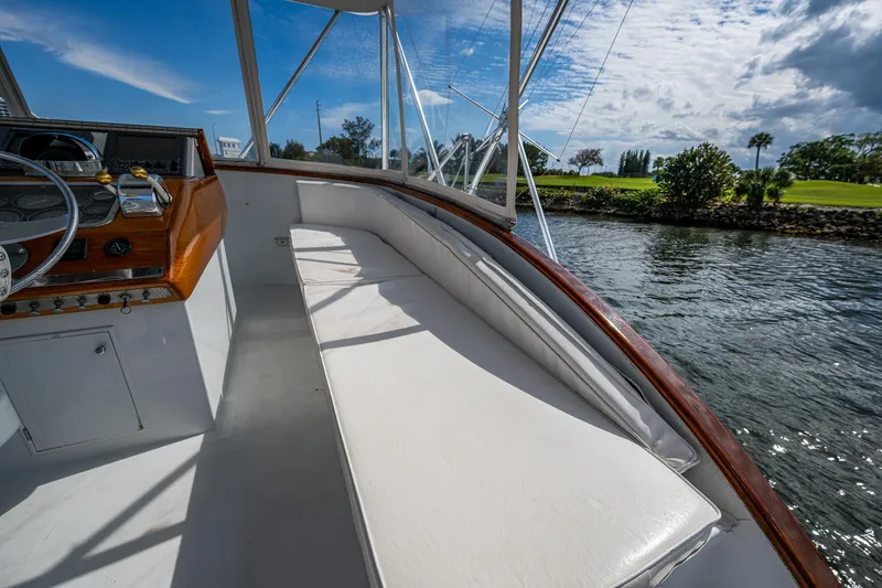 Able Hand Yacht Photos Pics 1978 Graves 51 boat interior with white seating, wooden accents, and scenic water view.