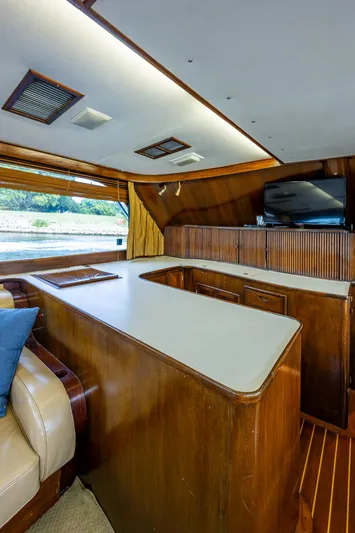 Able Hand Yacht Photos Pics Interior of a 1978 Graves 51 yacht with wooden cabinetry and seating.