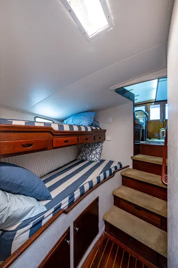 Able Hand Yacht Photos Pics Interior of 1978 Graves 51 boat with bunk beds and wooden stairs.