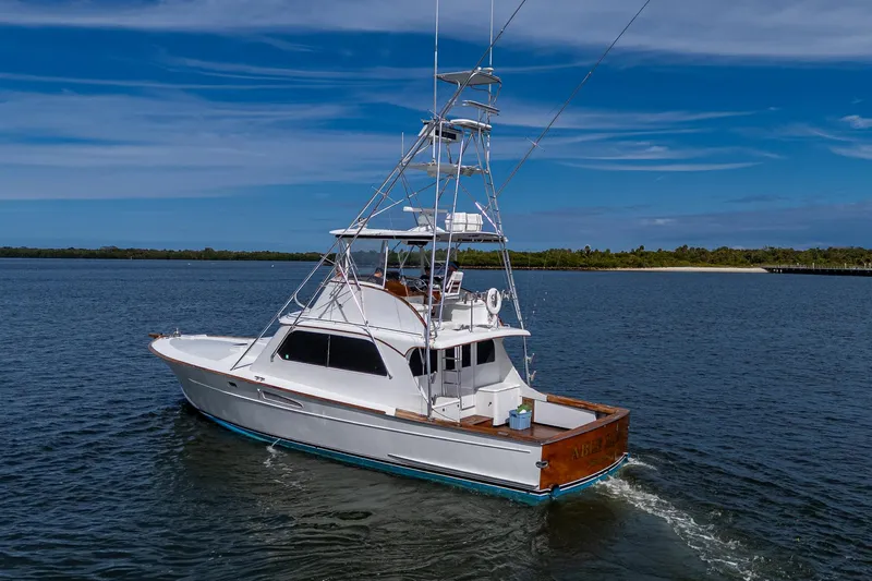 Able Hand Yacht Photos Pics 1978 Graves 51 boat cruising on calm water under a clear blue sky.