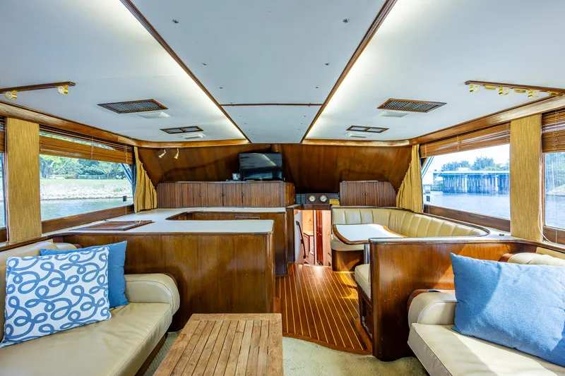 Able Hand Yacht Photos Pics Luxurious 1978 Graves 51 yacht interior with wood paneling and plush seating.