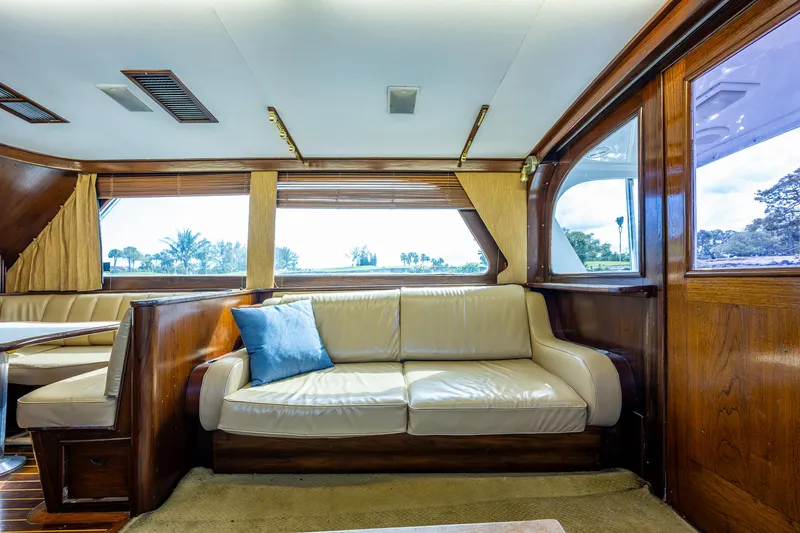 Able Hand Yacht Photos Pics Luxurious interior of a 1978 Graves 51 yacht with plush seating and wooden accents.