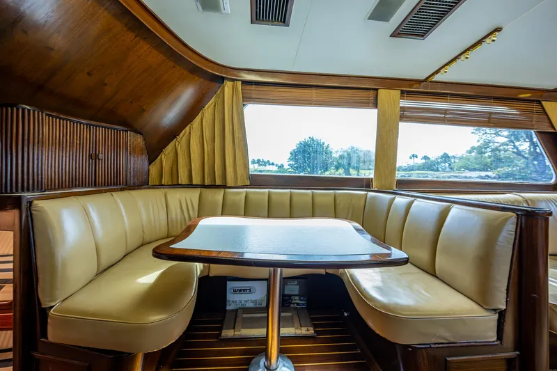 Able Hand Yacht Photos Pics Vintage 1978 Graves 51 yacht interior with leather seating and wooden table.