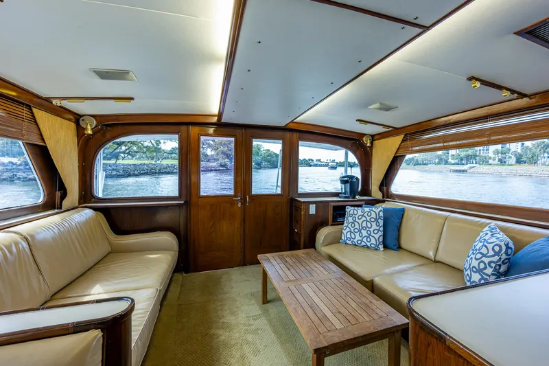 Able Hand Yacht Photos Pics Luxurious 1978 Graves 51 yacht interior with beige seating and wooden accents.