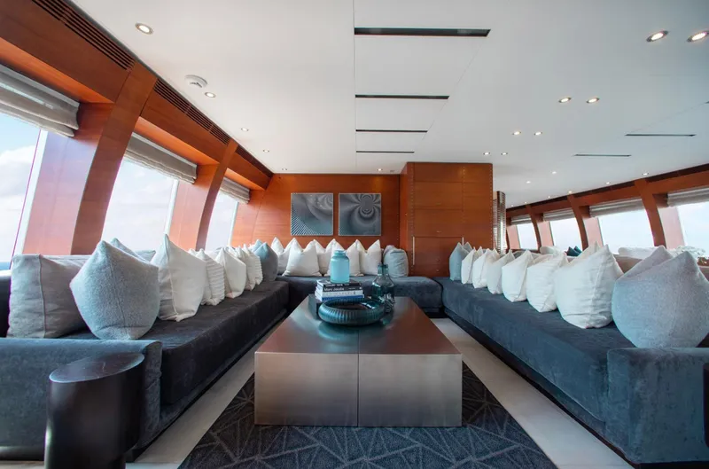Matrix Yacht Photos Pics Luxurious interior of 1999 Baglietto 41M yacht with plush seating and modern decor.