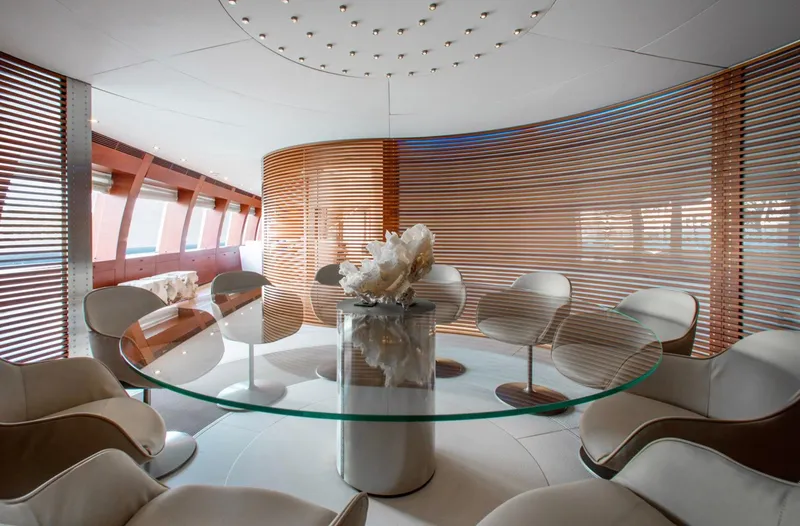Matrix Yacht Photos Pics Luxurious interior of 1999 Baglietto 41M yacht with modern seating and glass table.