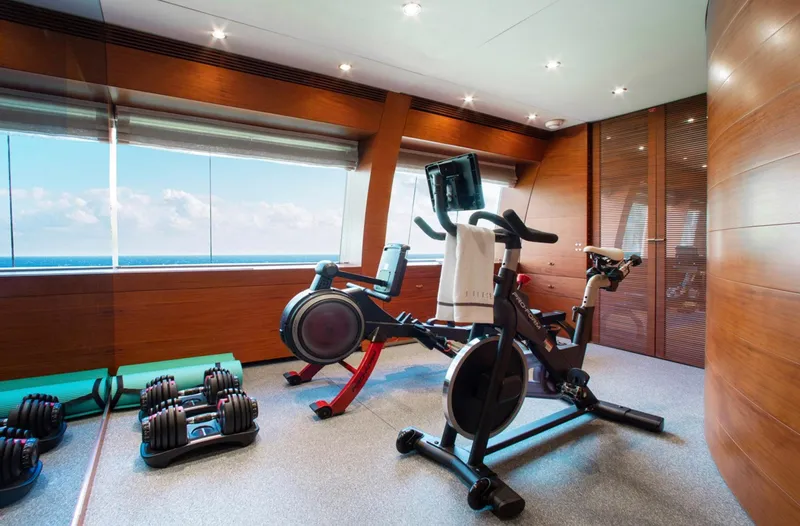 Matrix Yacht Photos Pics Luxury yacht gym with exercise bikes and weights, Baglietto 41M, 1999 model.