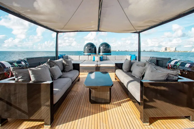 Matrix Yacht Photos Pics Luxurious deck of 1999 Baglietto 41M yacht with elegant seating and ocean view.