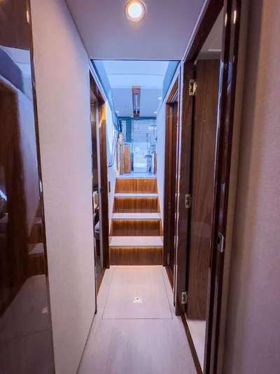  Yacht Photos Pics 2024 Riviera 465 SUV interior hallway with modern design and wooden accents.