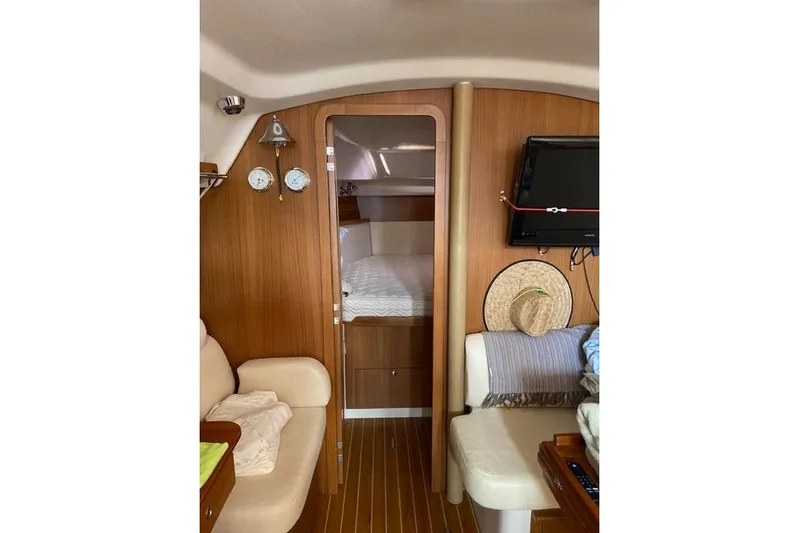 Perfect Timing Yacht Photos Pics Interior of 2011 Catalina 355 sailboat with cozy cabin and wooden finish.