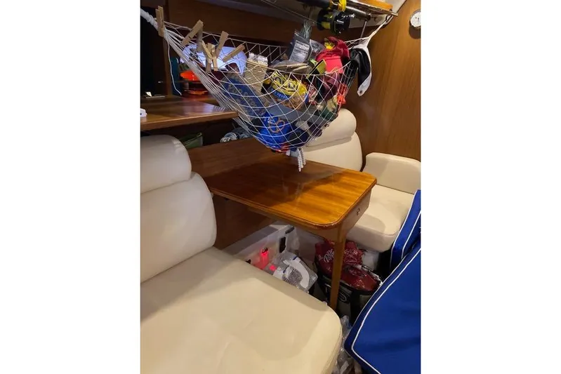 Perfect Timing Yacht Photos Pics Interior of a 2011 Catalina 355 sailboat with seating and storage net.