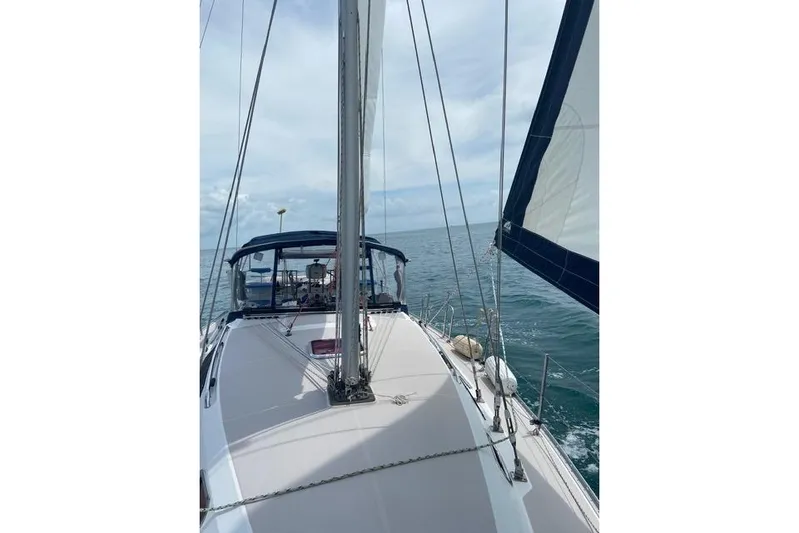 Perfect Timing Yacht Photos Pics Sailing on a 2011 Catalina 355 yacht in open waters under a clear sky.