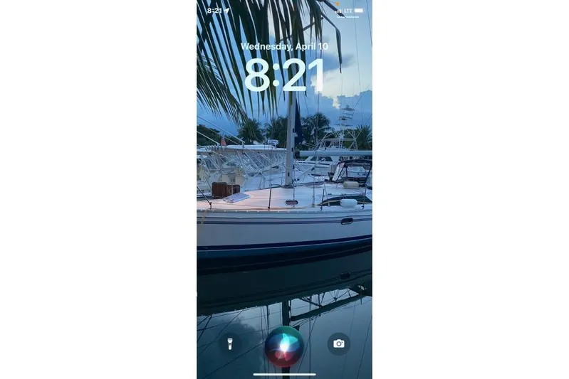 Perfect Timing Yacht Photos Pics Sailboat Catalina 355, 2011 model, docked under palm trees at sunset.