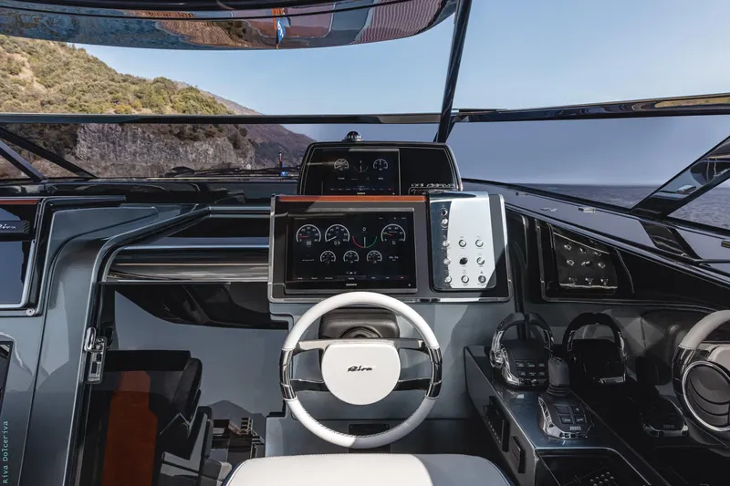  Yacht Photos Pics 2021 Riva Dolceriva yacht cockpit with modern steering and navigation controls.