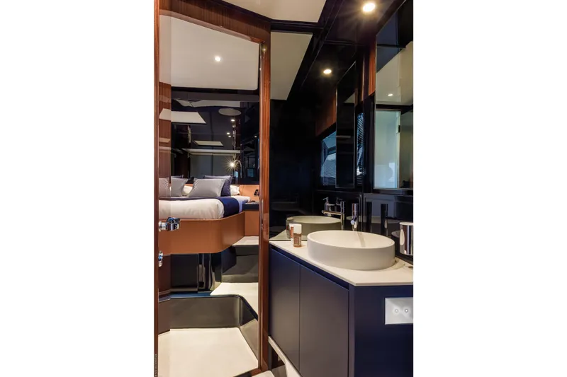  Yacht Photos Pics Luxurious interior of 2021 Riva Dolceriva yacht featuring modern bathroom and bedroom design.