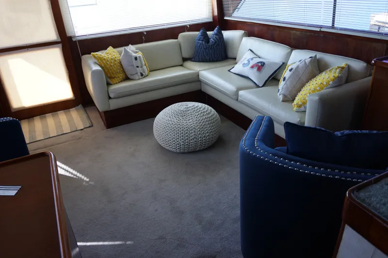 The Dog House Yacht Photos Pics Luxurious 1988 Ocean Yachts Super Sport interior with cozy seating and decorative pillows.