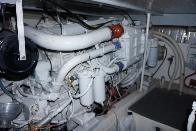 The Dog House Yacht Photos Pics Engine room of 1988 Ocean Yachts Super Sport, showcasing complex machinery and components.