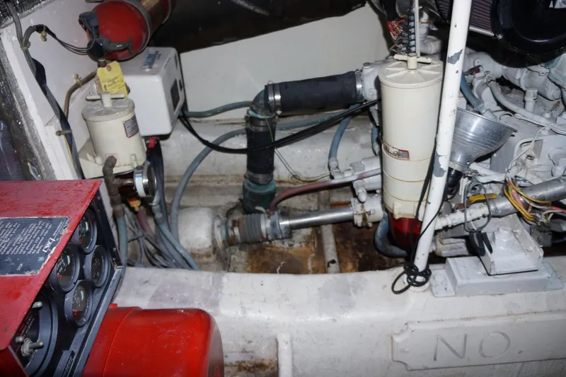 The Dog House Yacht Photos Pics Engine room of 1988 Ocean Yachts Super Sport, showcasing mechanical components and wiring.