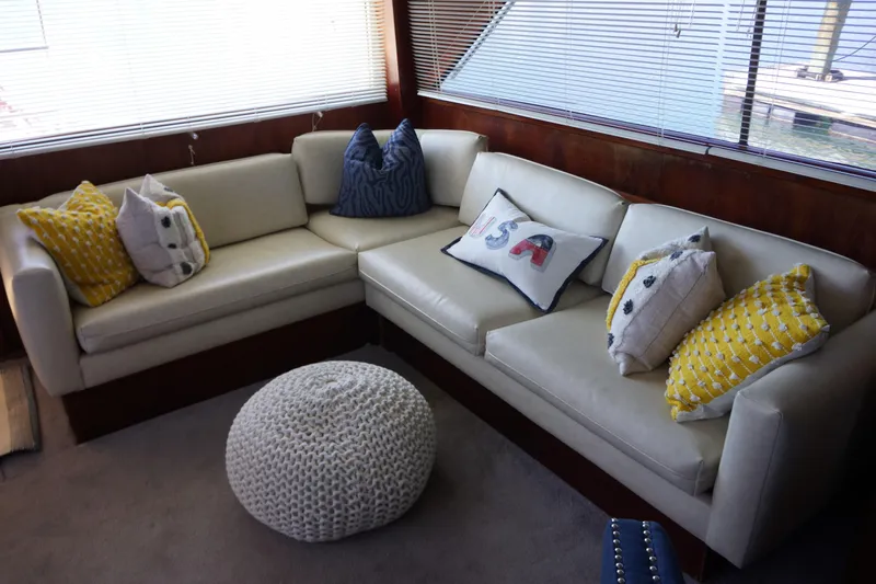 The Dog House Yacht Photos Pics Interior of 1988 Ocean Yachts Super Sport with cozy seating and decorative pillows.