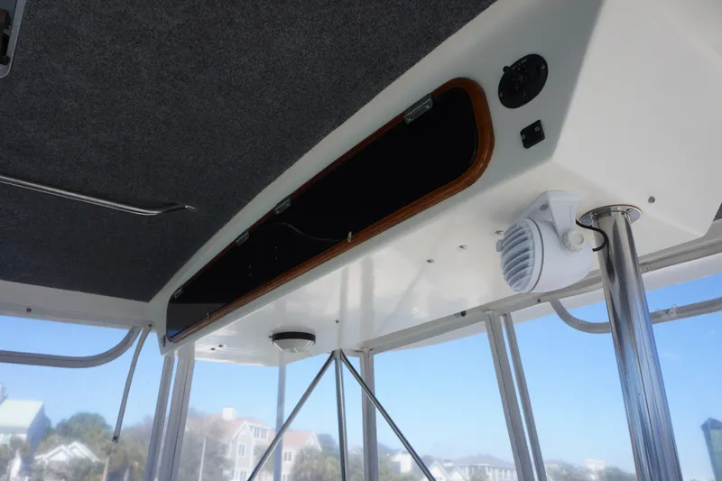 The Dog House Yacht Photos Pics 1988 Ocean Yachts Super Sport interior ceiling with speaker and storage compartment.