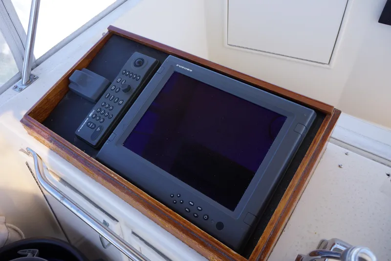 The Dog House Yacht Photos Pics Control panel of 1988 Ocean Yachts Super Sport with navigation equipment.