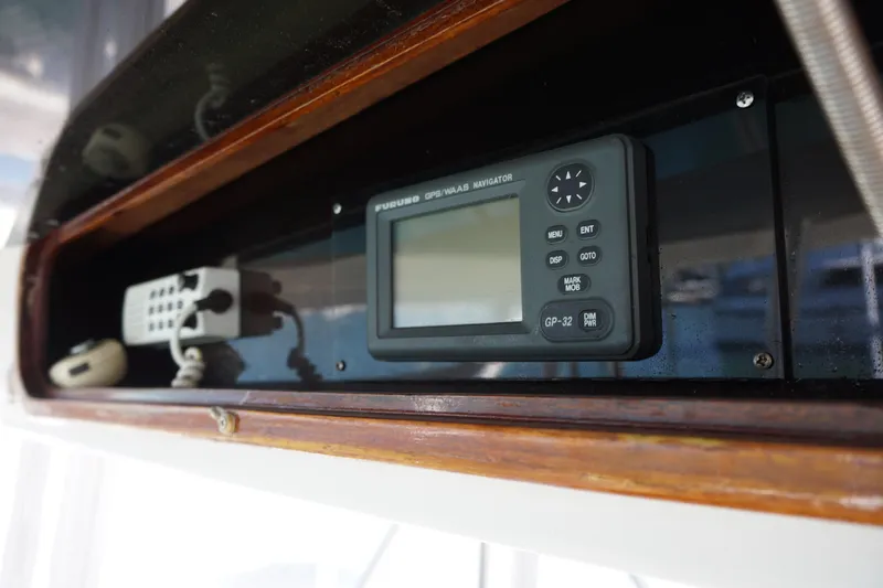The Dog House Yacht Photos Pics 1988 Ocean Yachts Super Sport navigation equipment with GPS display and control panel.